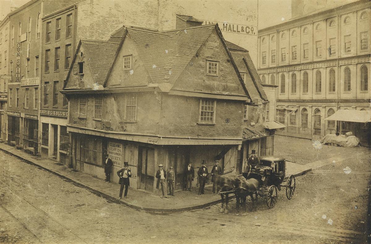 JOHN A. WHIPPLE, ATTRIBUTED TO (1822-1891) The Old Feather Store on the corner of North Street and Dock Square, near Faneuil Hall.